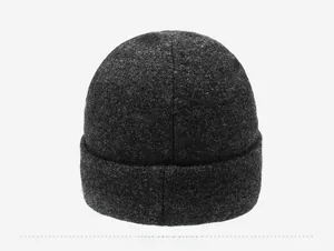 Detail view of the back of a thick dark grey knitted beanie showing plush wool texture