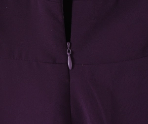 Detail view showing a seamless hidden zipper on purple chiffon vintage halter dress