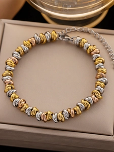 Detail of tricolor woven titanium steel bracelet with lobster clasp and extension chain