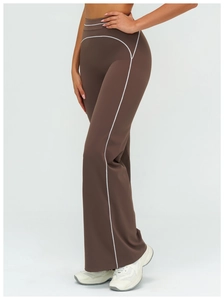 Detail view of high-waisted flared sweatpants with contrast white piping in coffee brown