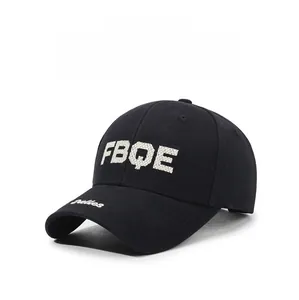 Close-up of thick white FBQE embroidery and Palles script on black baseball cap brim
