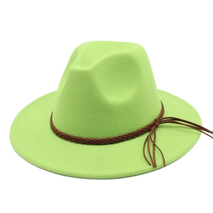 Classic light green wide brim fedora hat with a brown braided leather band on white background