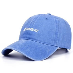 Close-up of blue washed cotton baseball cap featuring COYENRAT 3D embroidery detail