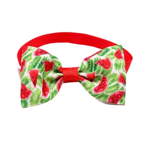 Detailed close-up of watermelon print pet bow tie with red strap for small dogs and cats