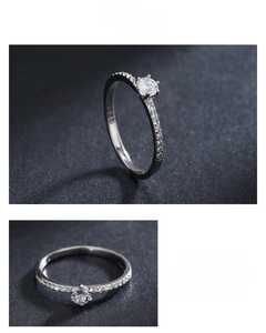 Detail of S925 sterling silver ring featuring a six-prong set sparkling round cubic zirconia