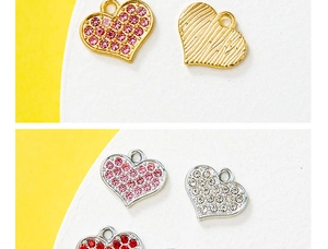 Detailed view of DIY heart pendants in gold and silver with colorful rhinestones