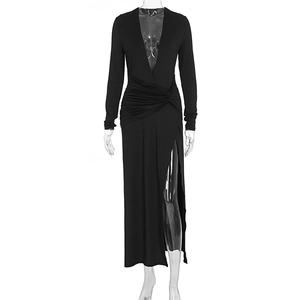 Detail of elegant black deep V-neck dress with long sleeves and gathered waist design