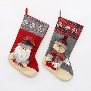 Pair of large knitted Christmas stockings with Santa and Snowman designs for gifts