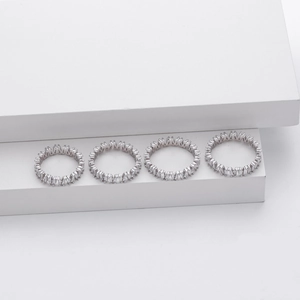 Macro detail of silver V-shaped rings with full baguette-cut cubic zirconia inlay