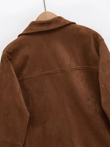 Detail showing the brown faux suede fabric texture and stitching on the back of the jacket