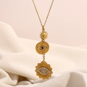 Gold-plated stainless steel necklace with sun pendant, evil eye charms and tassels