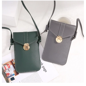 Detailed view of mini PU leather crossbody phone bags in green and grey with gold clasps