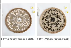Detail of round jute placemats with fringe edge and mandala floral printing