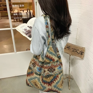 Detail of vintage plaid plush tote bag with bohemian geometric pattern and checkerboard lining