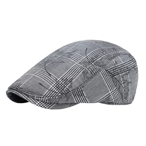 Classic black and white checkered ivy cap with stylized black line art patterns