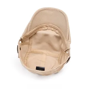 Close-up of the breathable mesh interior and material label of the beige beret hat
