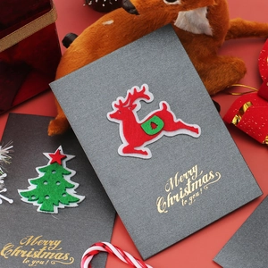 Vintage pearlescent Christmas card with 3D felt reindeer and gold foil lettering