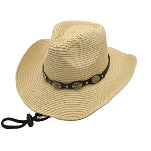 Beige straw cowboy hat with vintage leather belt and metal studs on white background