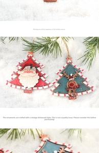 Detail of vintage wooden Christmas tree ornaments with Santa and reindeer on pine branches