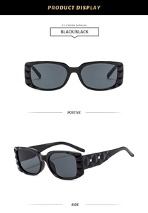Détail de lunettes de soleil noires rectangulaires avec texture diamant 3D sur la monture