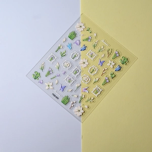 Macro detail of FEB-655 3D embossed nail stickers featuring white flowers and green leaves
