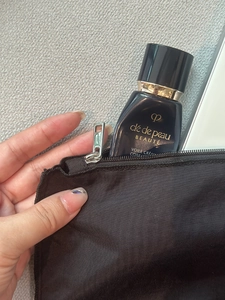 Macro detail of high-quality smooth zipper on a lightweight black nylon organizer insert