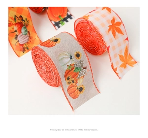 Macro view of autumn ribbons with pumpkin, maple leaf and plaid patterns on linen fabric