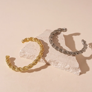 Modern minimalist twisted metal cuff bracelets in gold and silver finish for women
