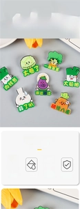 Detail view of colorful acrylic vegetable brooches with creative cartoon characters