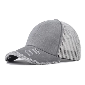 Detailed shot of grey washed denim baseball cap with ICON logo and distressed brim