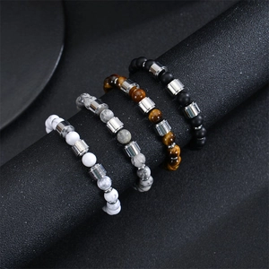 Stack of 8mm natural map stone and onyx bead bracelets with stainless steel spacers