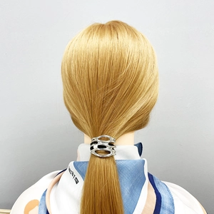 Silver alloy U-shaped ponytail clip with hollow design on blonde hair model
