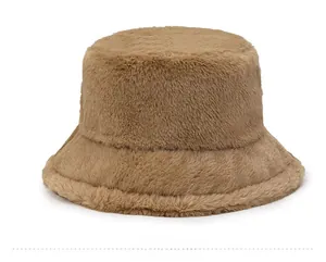 Close-up of plush faux rabbit fur texture on a brown winter bucket hat for women