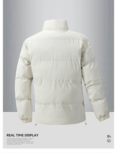Macro detail of windproof off-white winter jacket showing stand collar and drawstring hem
