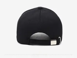Detail of the black cotton baseball cap with adjustable silver metal buckle on the back