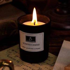 Scented candle in black glass jar for home fragrance and car air freshener use