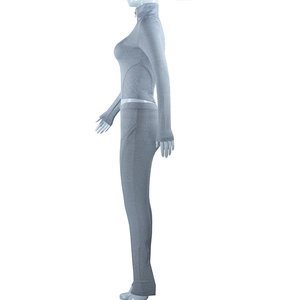 Detail view of grey two-piece compression yoga set with full zip collar and slim leggings