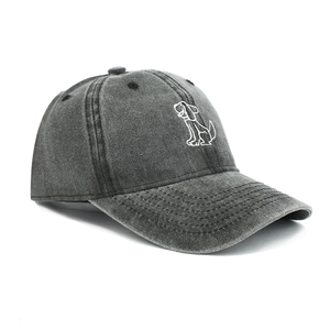 Close-up of a dark grey washed cotton baseball cap with white cartoon dog embroidery