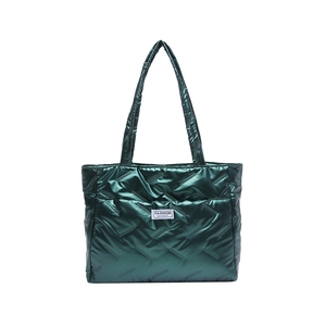 Metallic green quilted down tote bag with spacious design and shoulder straps