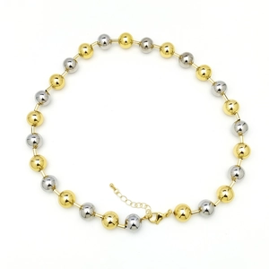 Detail of two-tone gold and silver beaded necklace with adjustable lobster clasp closure