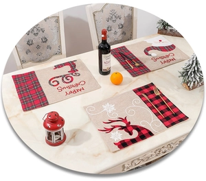 Macro detail of Christmas placemat with reindeer and Santa Claus on festive table