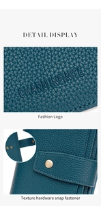 Detail view of teal RFID leather wallet with fashion logo and texture hardware snap fastener