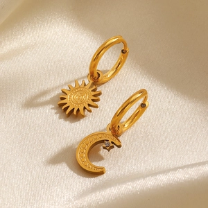 Asymmetric gold stainless steel sun and moon huggie earrings with star-shaped crystal