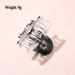 Detail view of small 4.5cm acetate hair claw clip with size and weight 9g specs