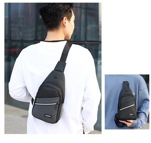 Detail of multi-layer oxford cloth chest bag with grey and black patchwork and fashion label