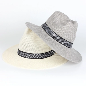 Detailed view of beige and gray straw fedora hats with stylish herringbone ribbon bands