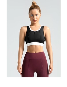 Close-up of high-impact vertical ribbed sports bra with contrast black and white design