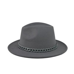 Detailed close-up of grey wool fedora hat featuring a stylish matching chain decoration