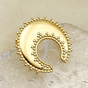 Macro shot of gold-plated crescent moon ring with delicate granulation metal bead detail