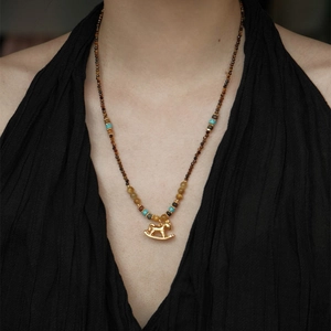 18K gold plated tiger eye necklace with turquoise beads and vintage rocking horse pendant